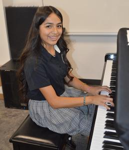 Student playing piano
