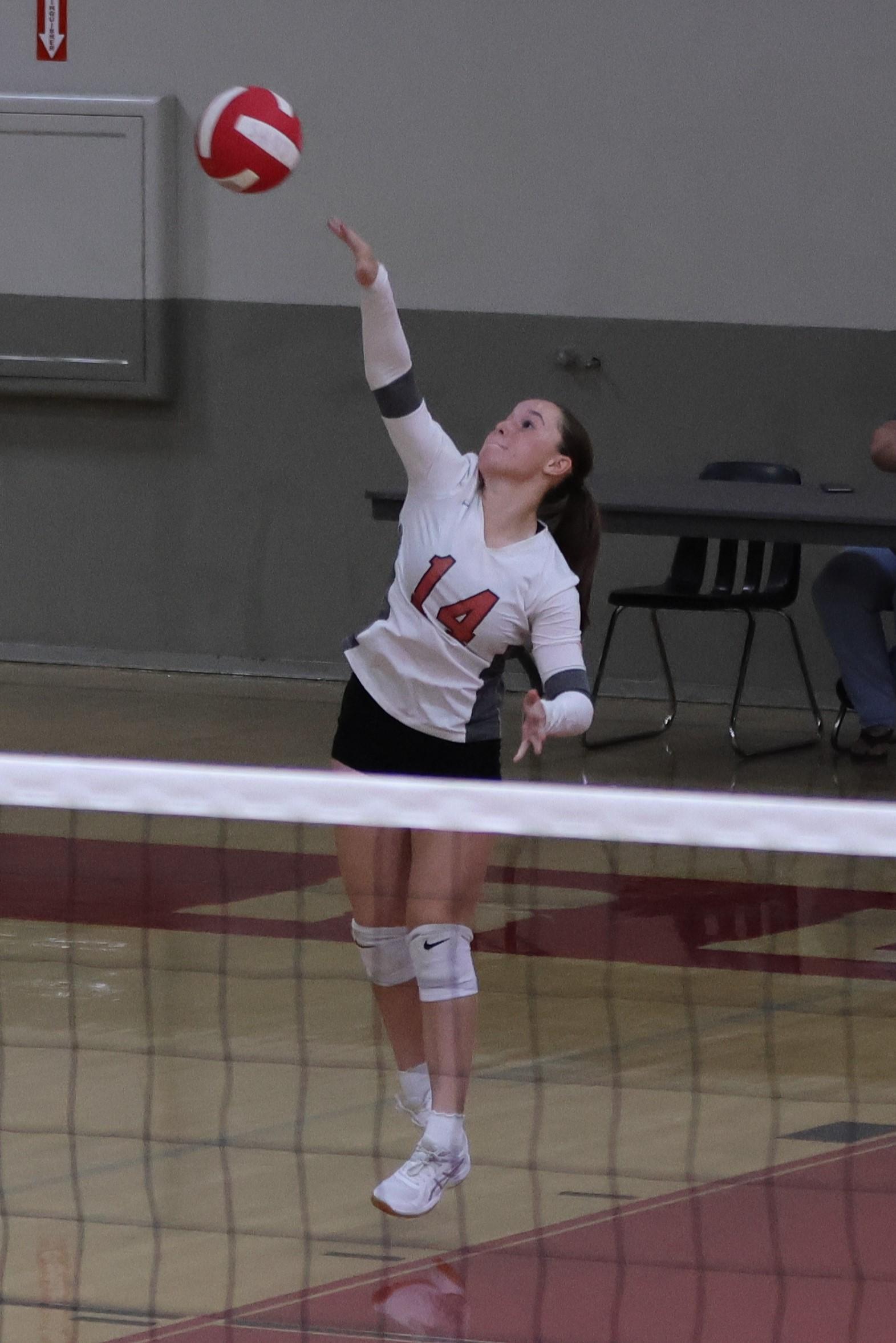 junior varsity girls playing volleyball 83