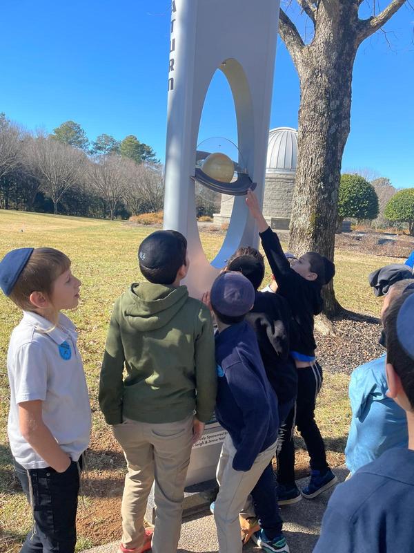 Boys explore the space exhibit at the tellus museum.