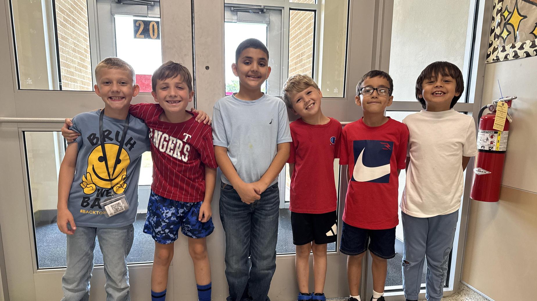 Seminole Primary students smiling by the doors.