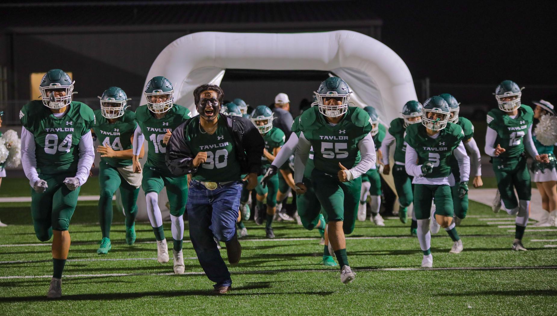 Football team entering field