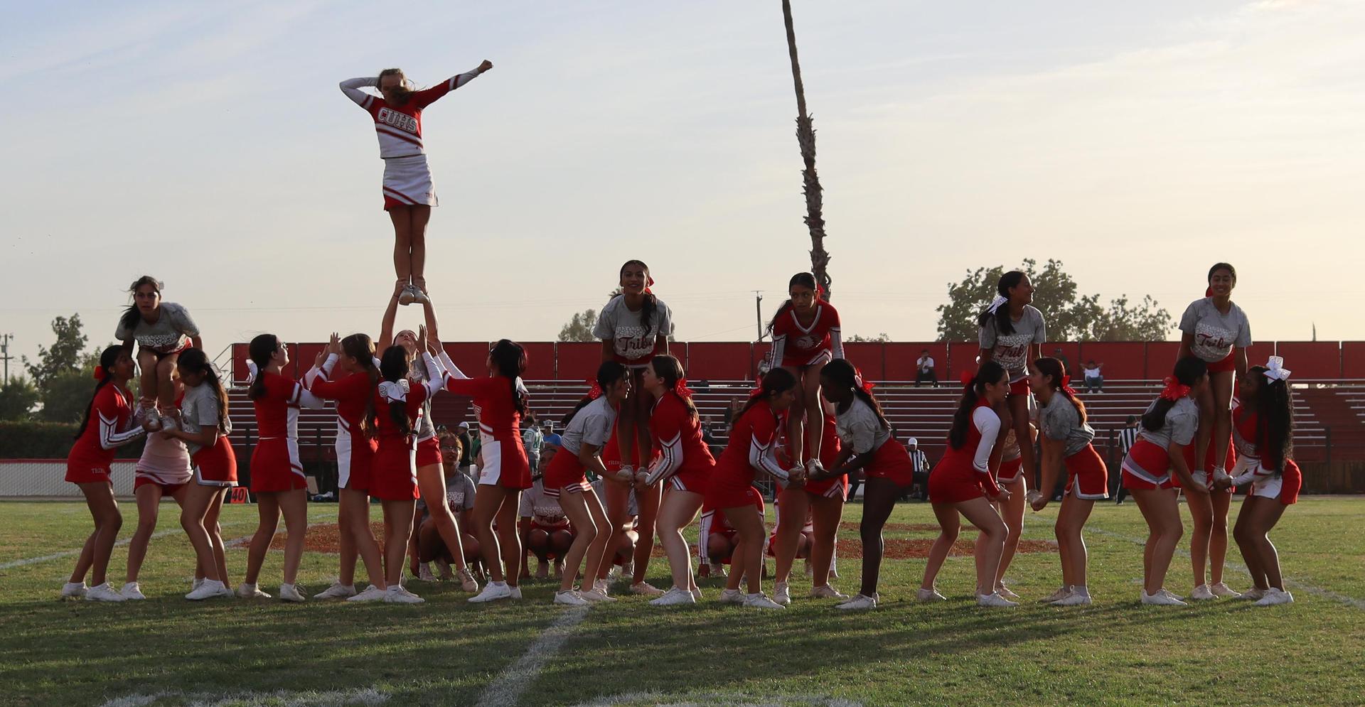 Combined cheer performing at halftime of the football game