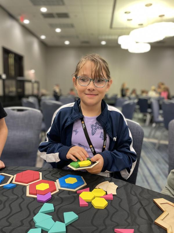 Lilly Griswold works with shapes at the welcome weekend.