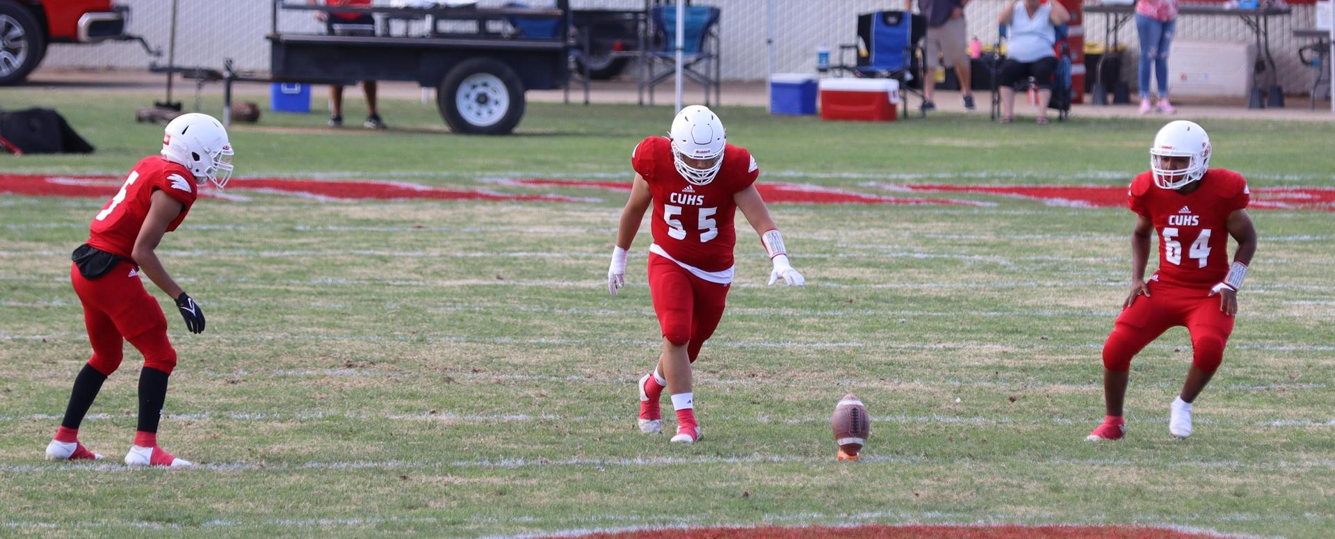  junior varsity football players in action against riverdale