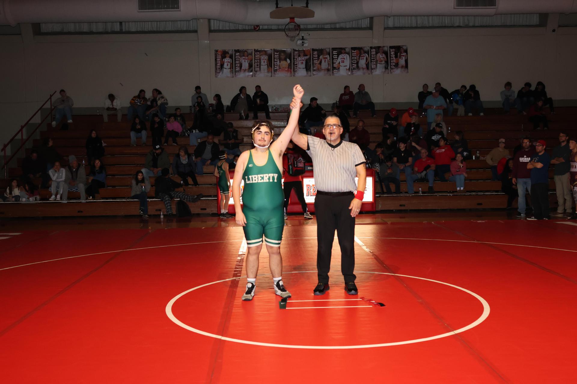 Wrestling winners with hands up 77