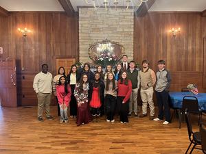 Group picture of Student Council in front of fireplace.