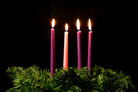 advent wreath with four candles lit