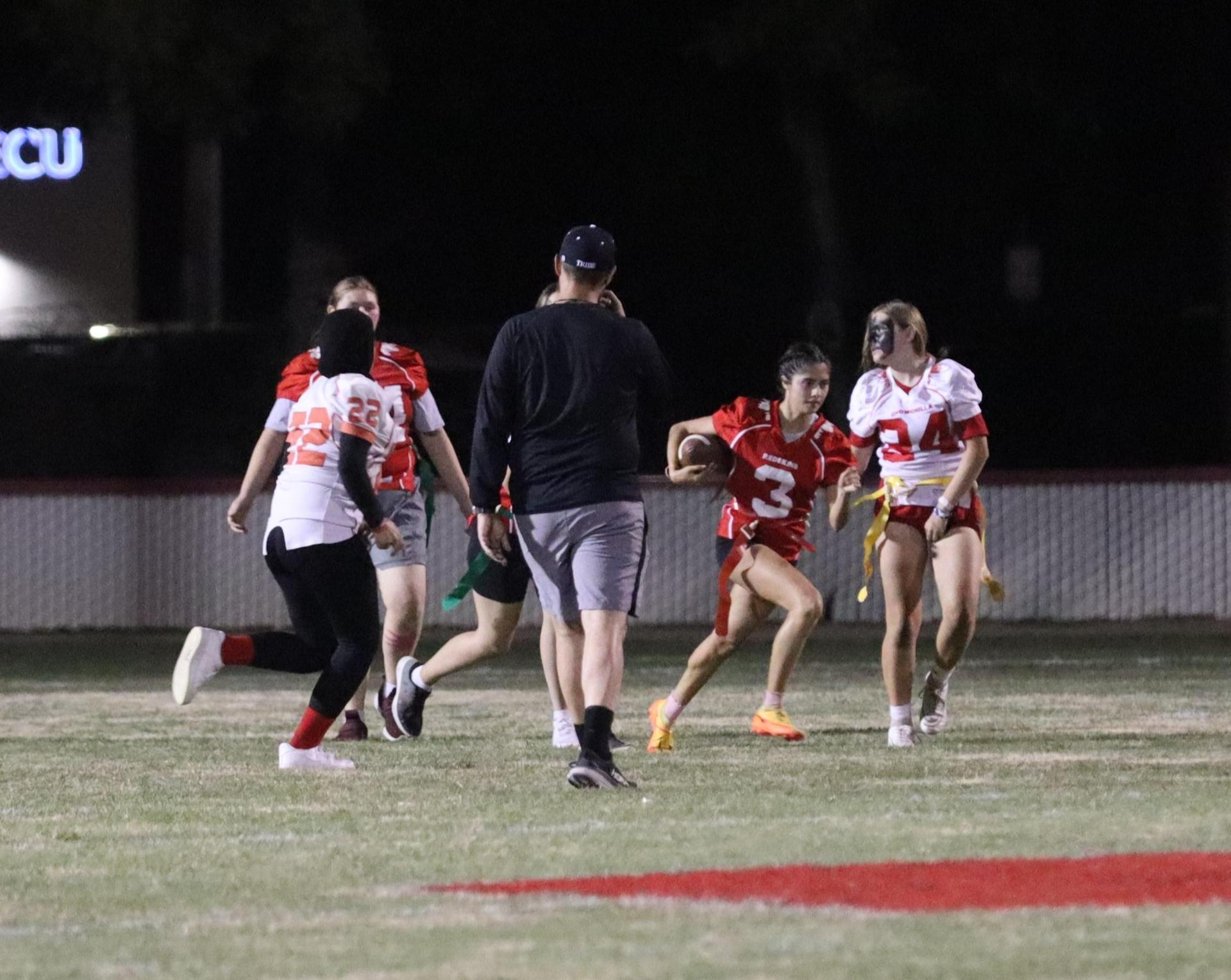 girls playing flag football