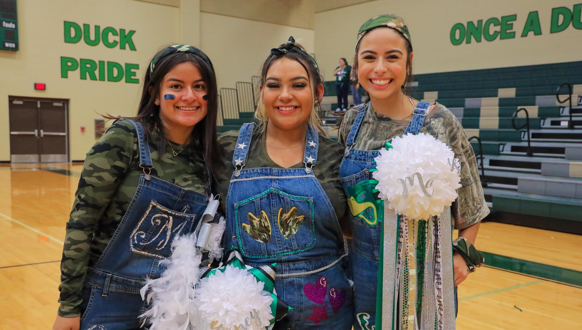 Students wearing homecoming mums.
