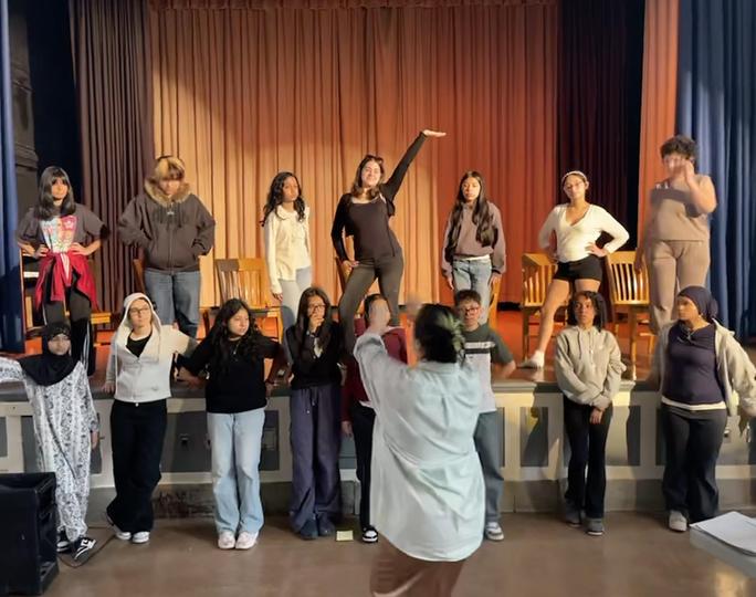 Drama students preparing for a performance