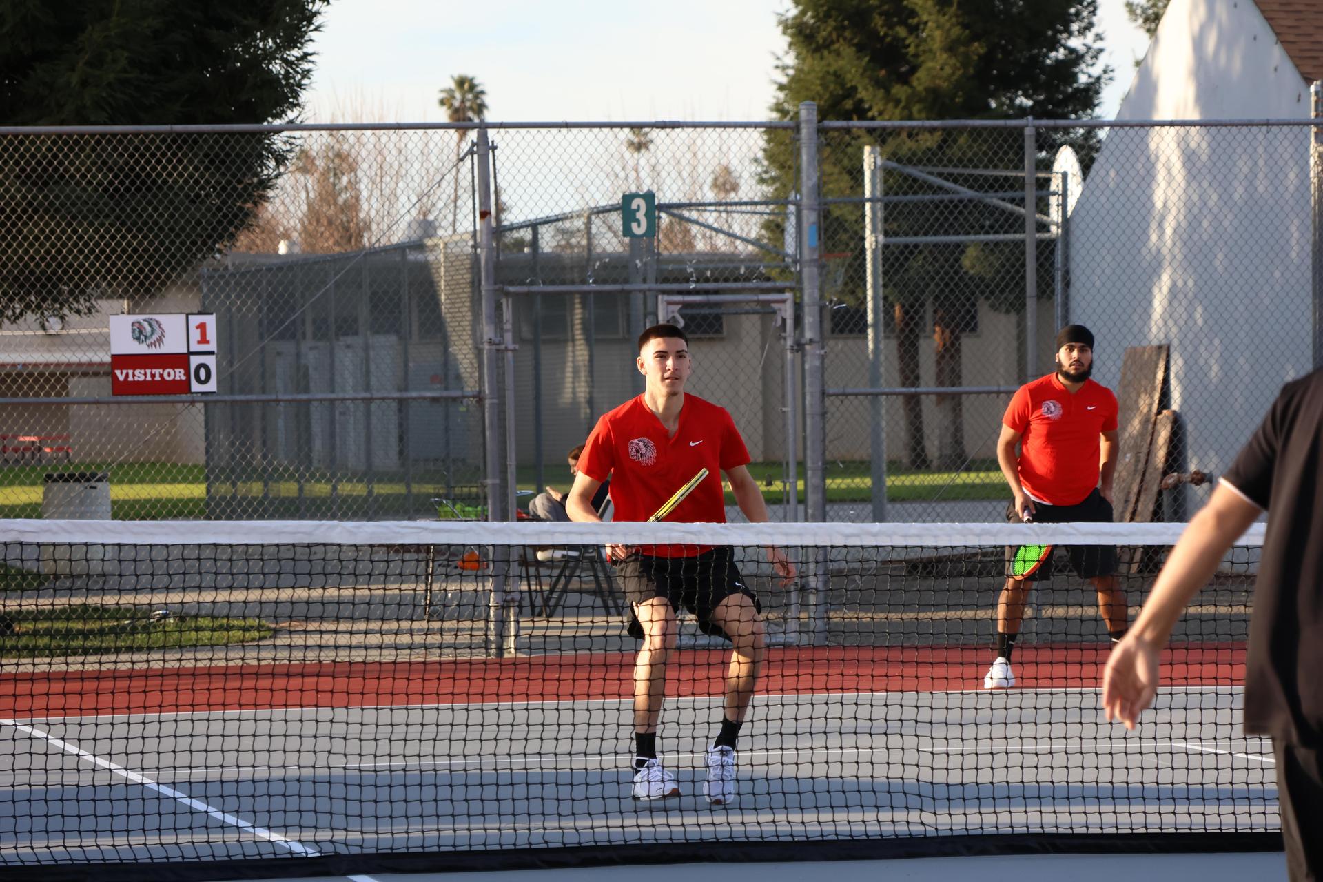 CUHS Boys playing tennis against coalinga