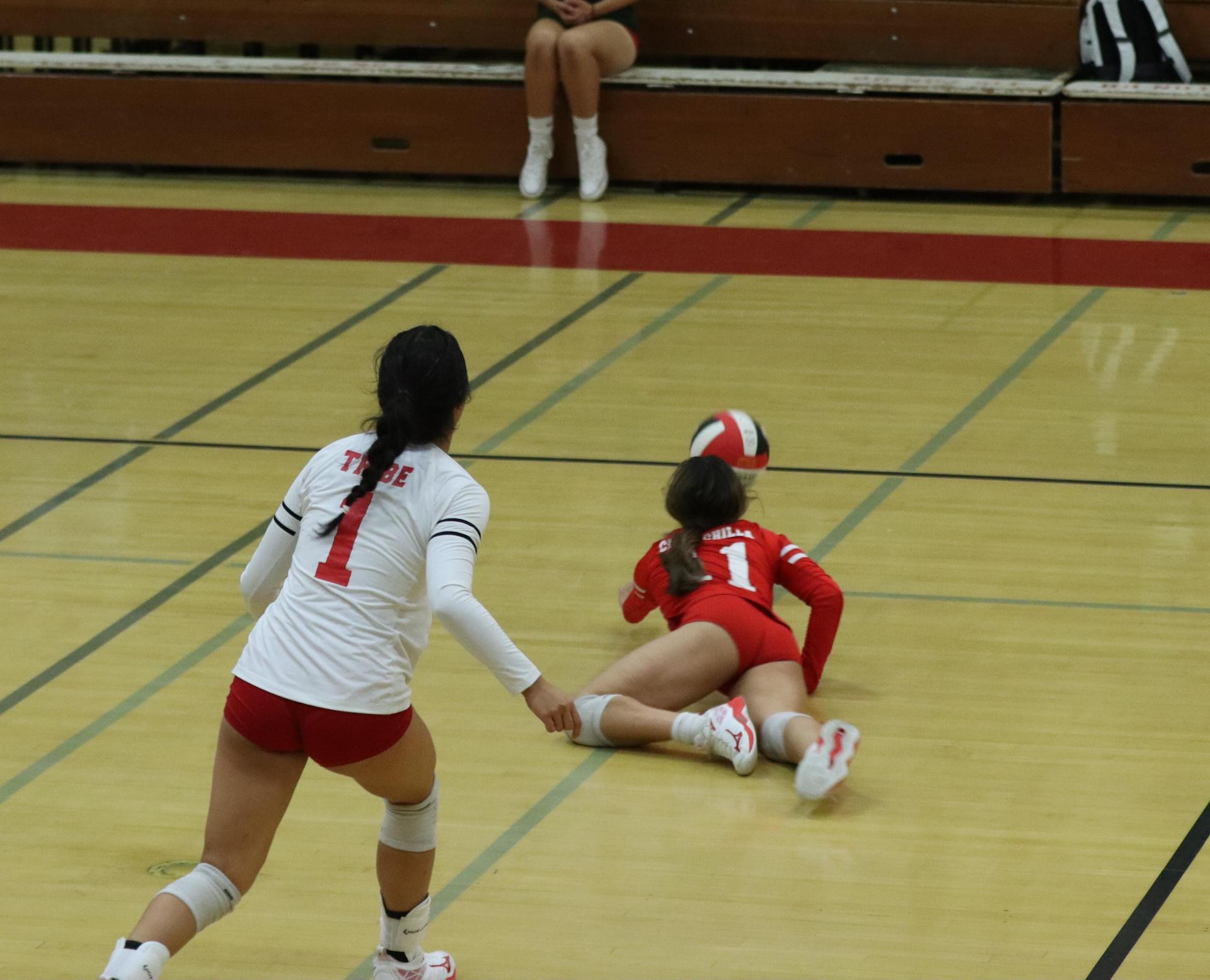 varsity volleyball players in action against golden valley