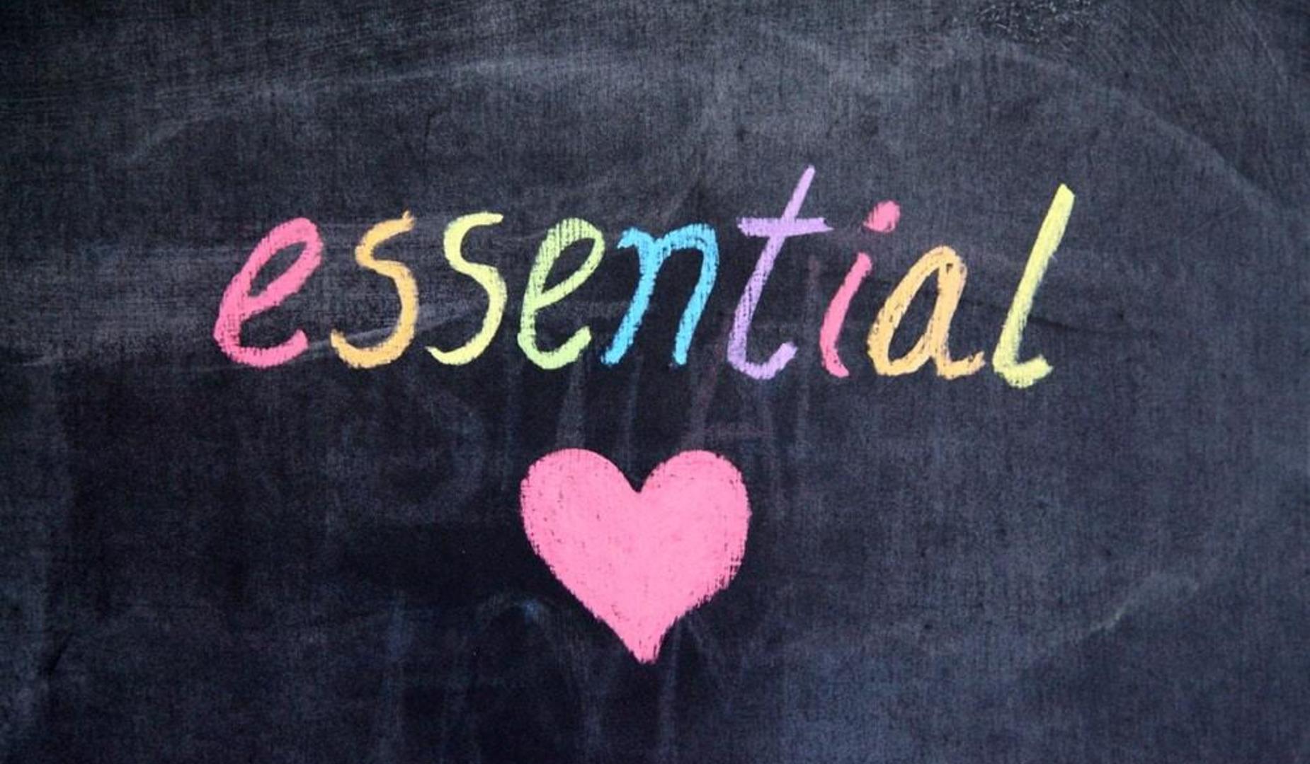 Essential spelled out with heart on chalkboard