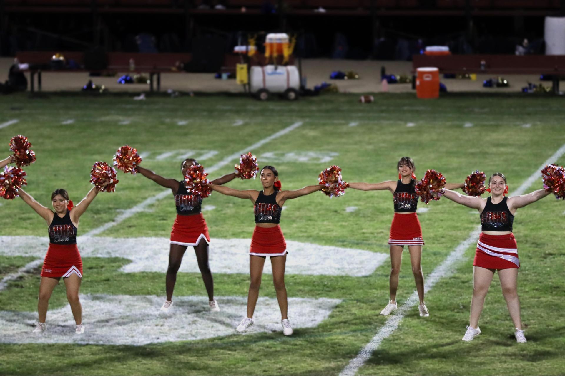 Varsity girls cheering at the Parlier football game