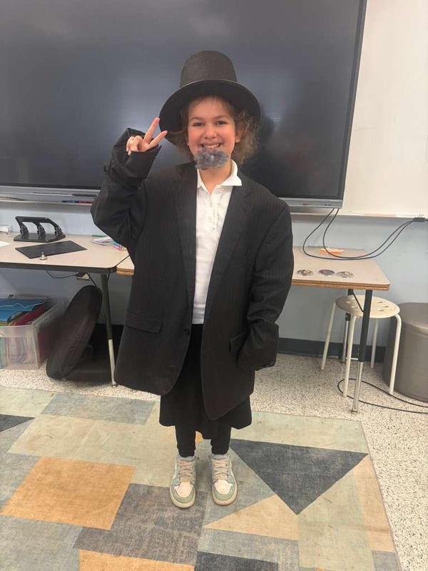 Aliza Holtzer dresses up as Abraham Lincoln to deliver the Gettysburg Address.