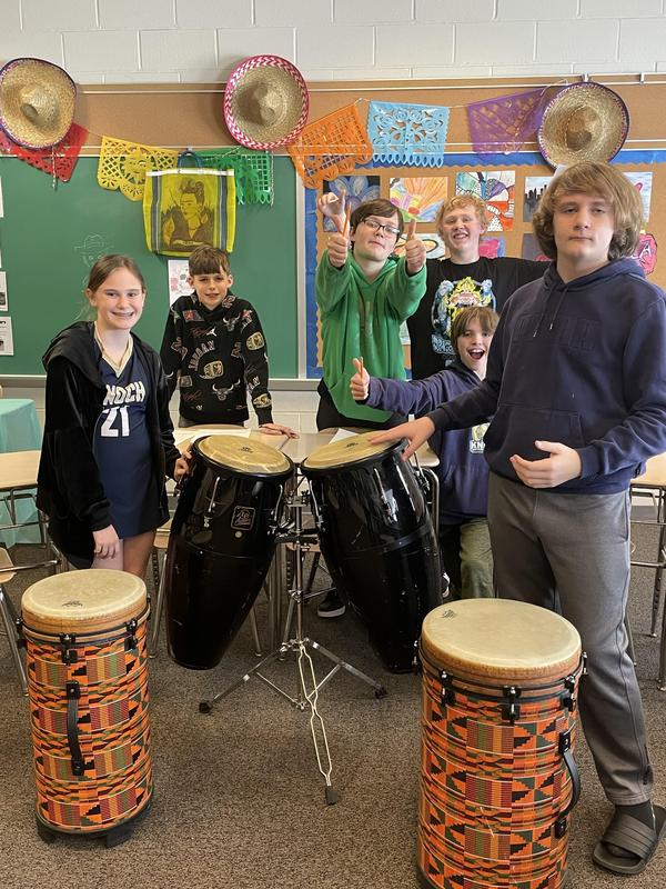 group of students playing on bongos