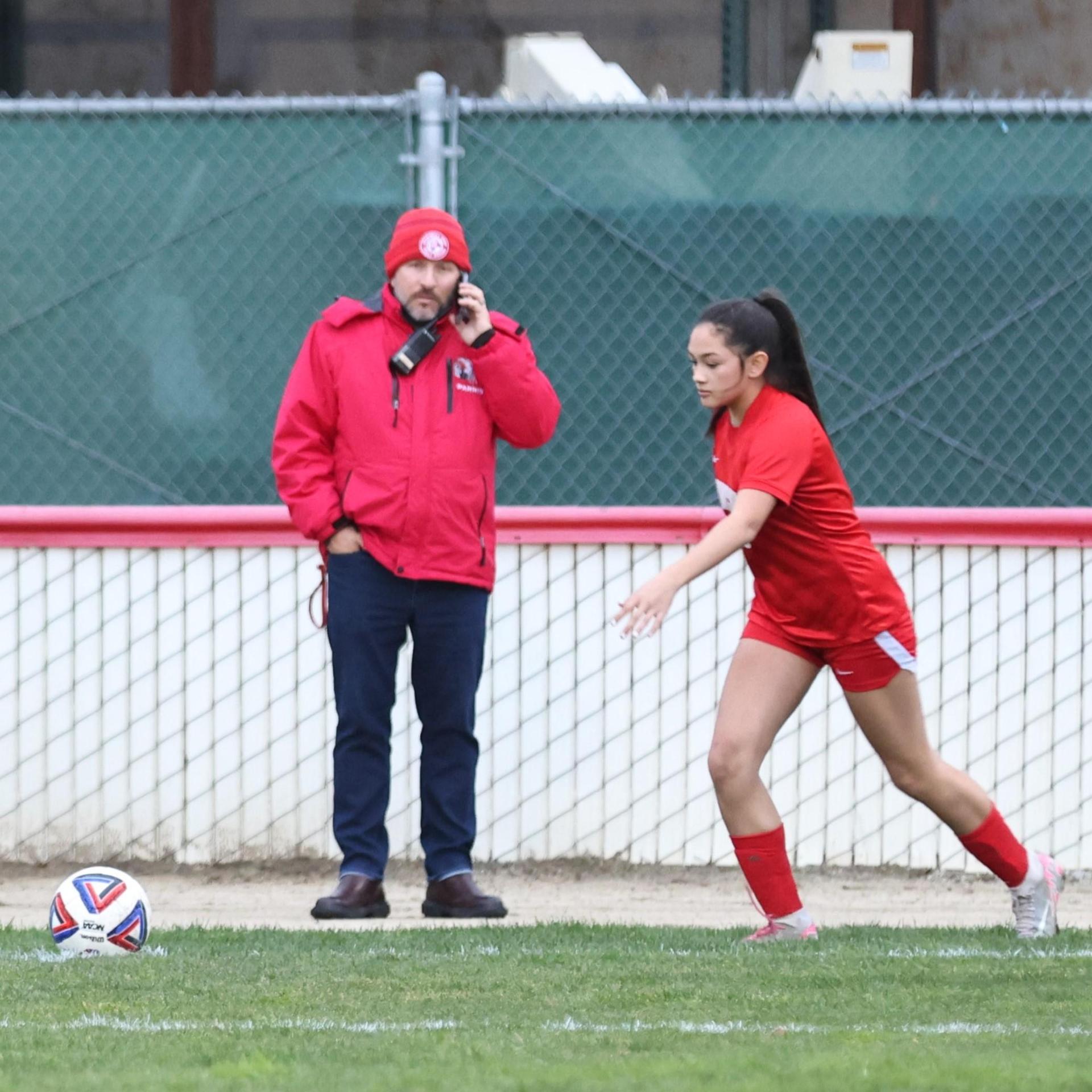 Junior varsity girls playing soccer against liberty