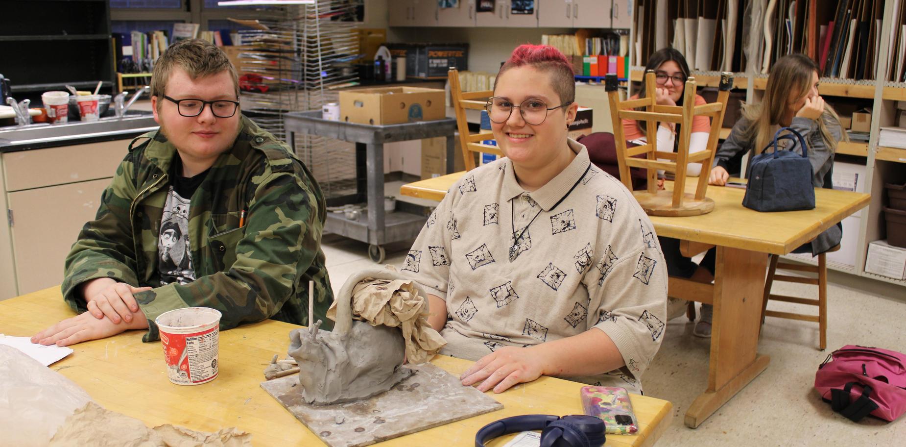 student working on clay project