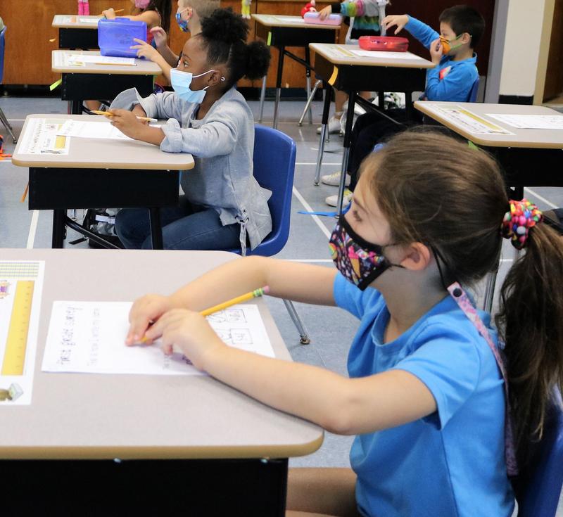 Photo of students at desks during class