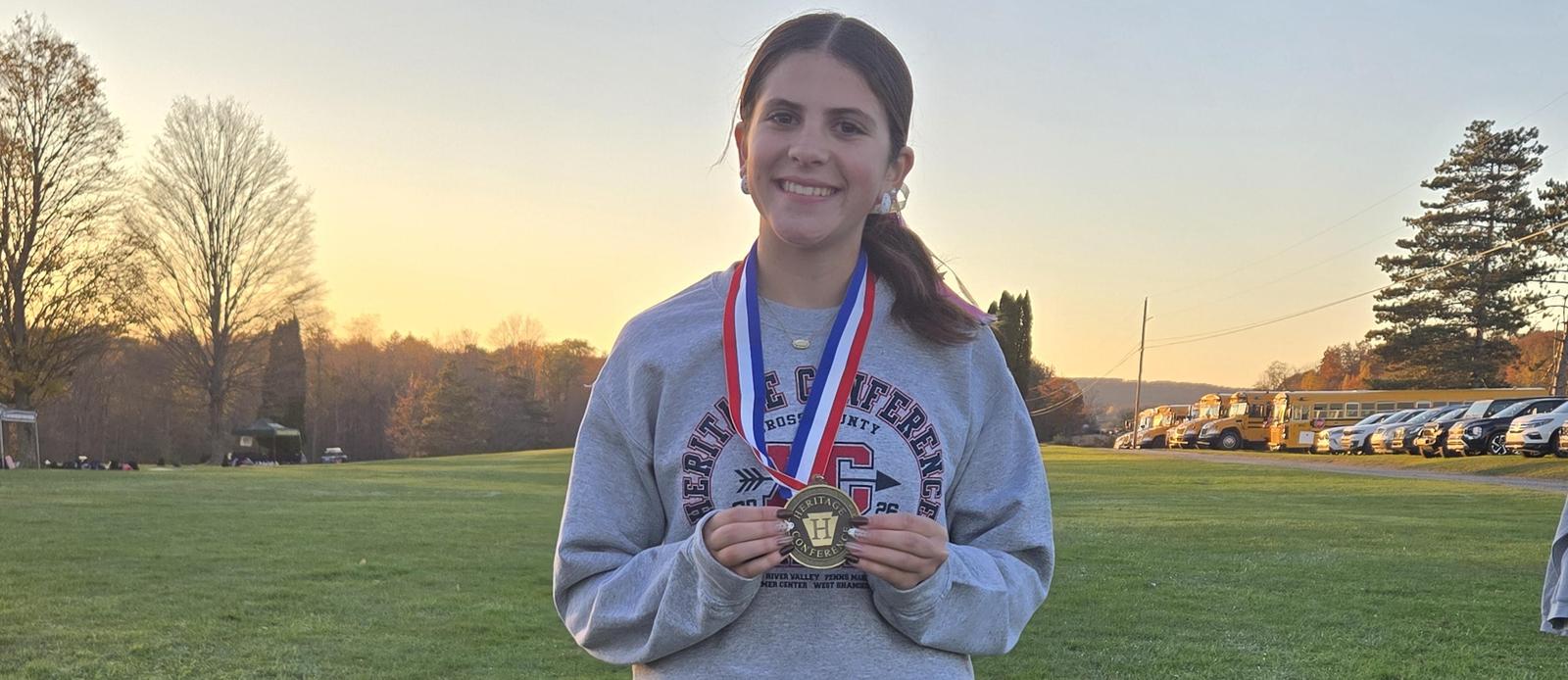 Peyton Wynette wins first place at the Hertigage Confernece Cross Country Championship.