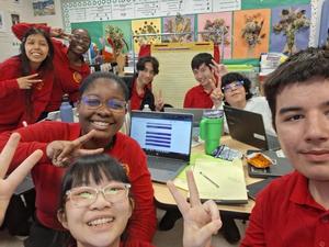 a group of students smiling to the camera