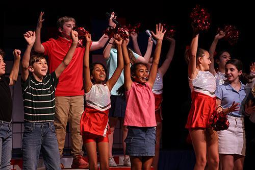 A group of students singing during a musical production at JRDS.