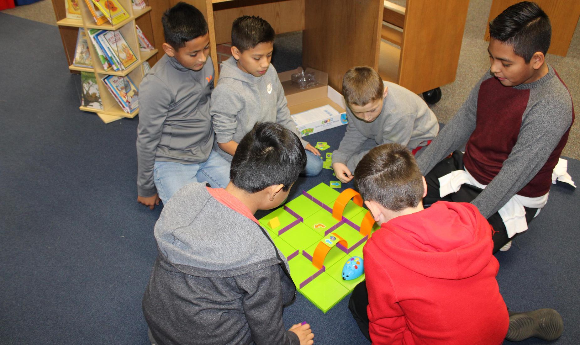 Students learning to code with mouse game