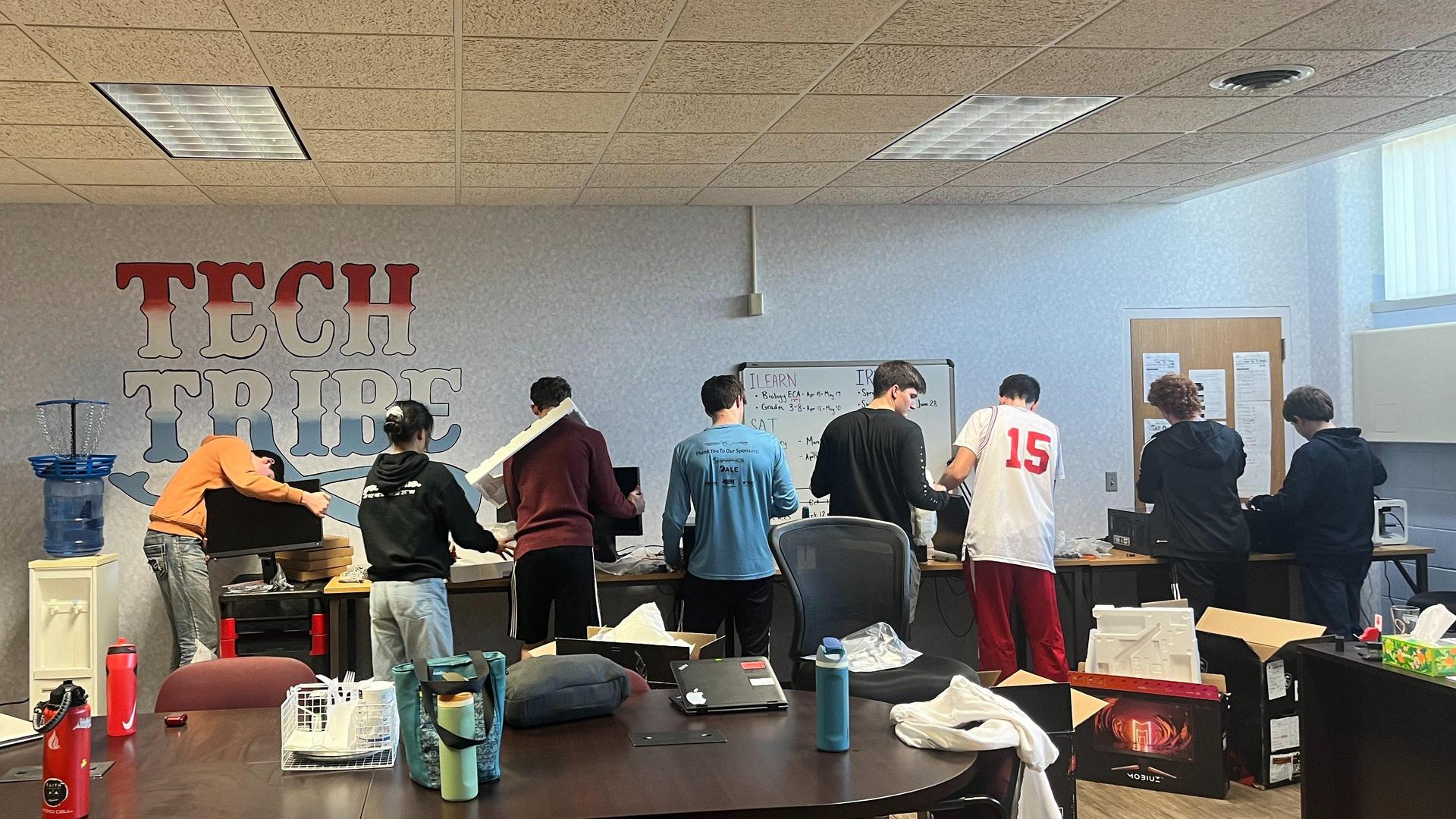 Tech Tribe students working or learning