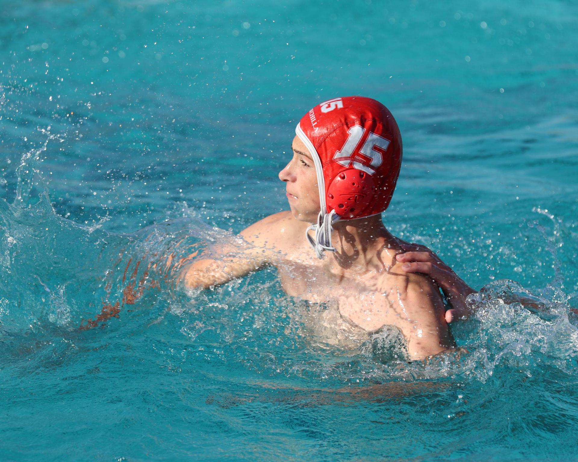 Boys playing water polo against Yosemite