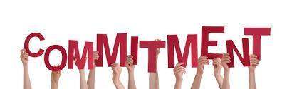 Hands hold up the individual letters that form the word