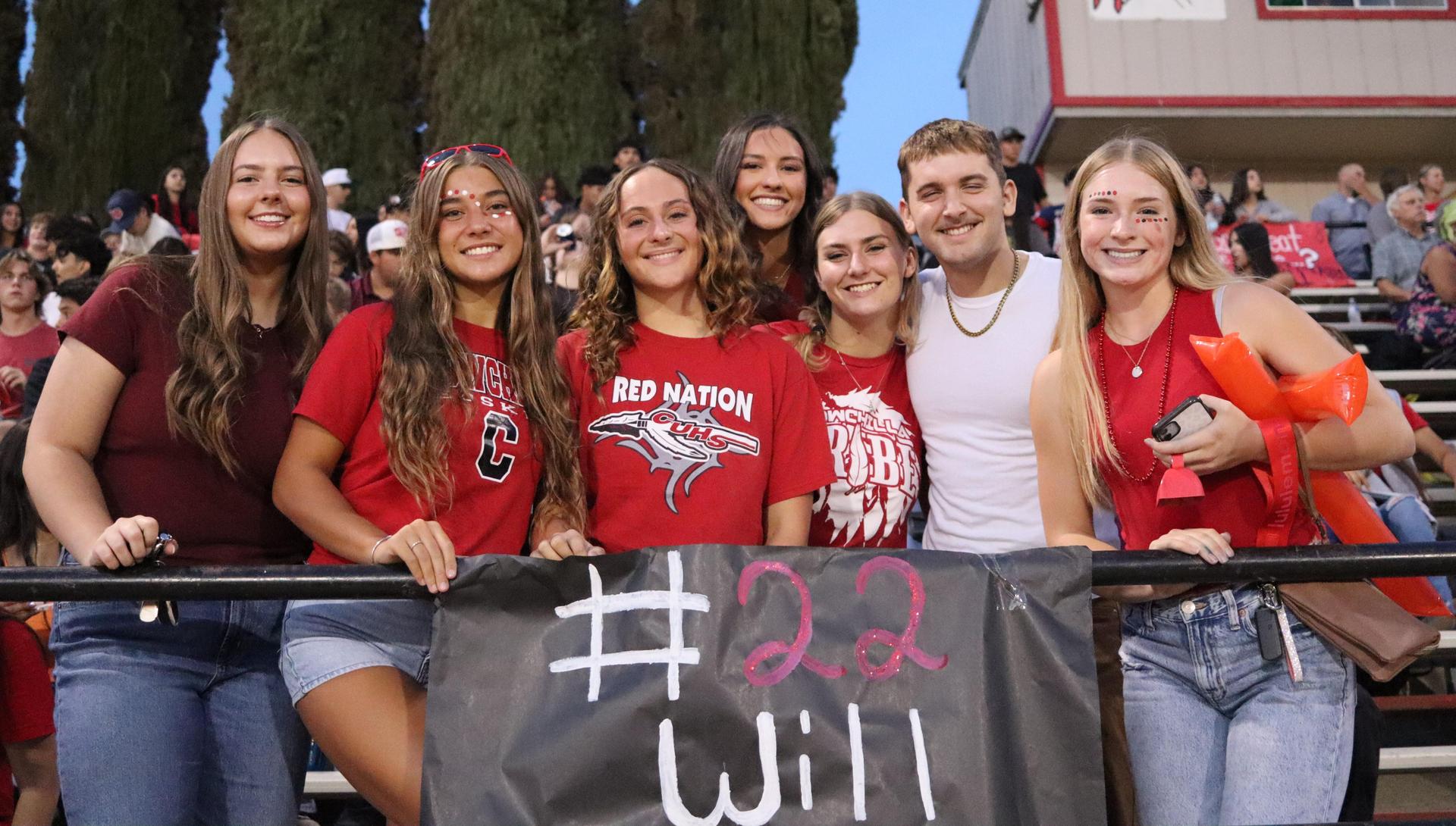 students, staff, and community members enjoying Friday night at the football game