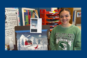 Middle School Student standing next to her artwork.