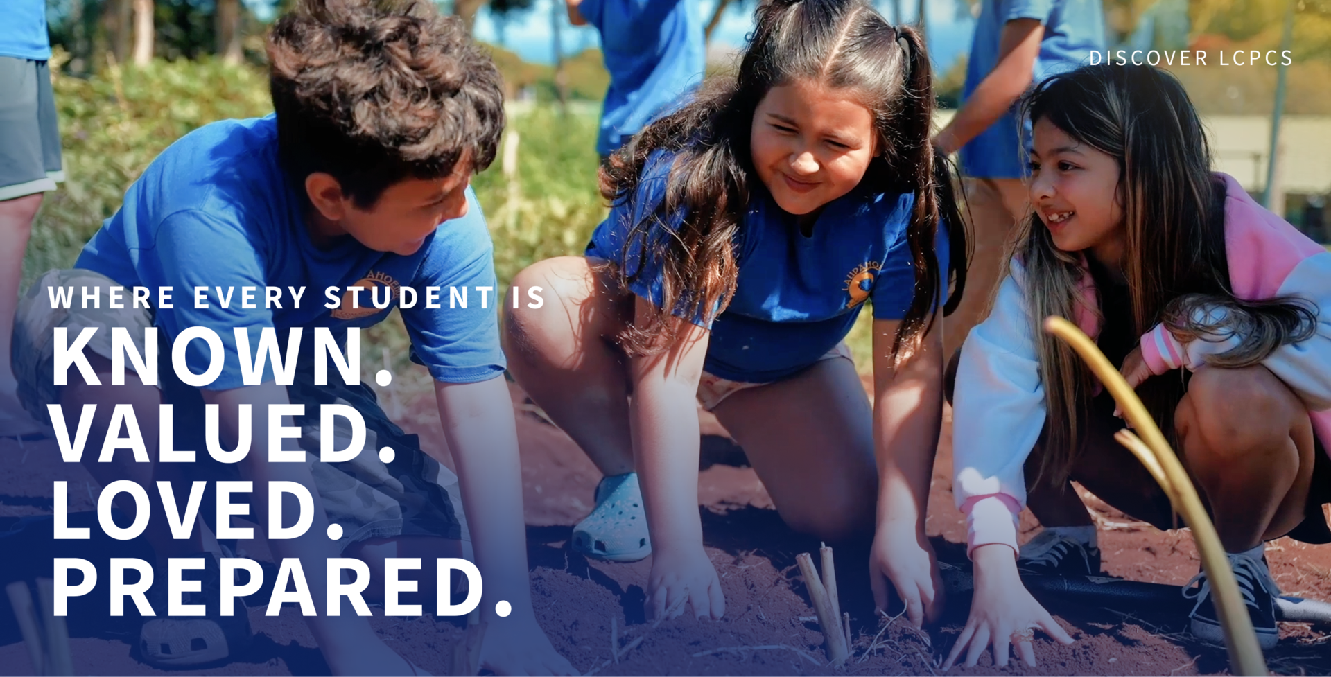 students smiling in the garden