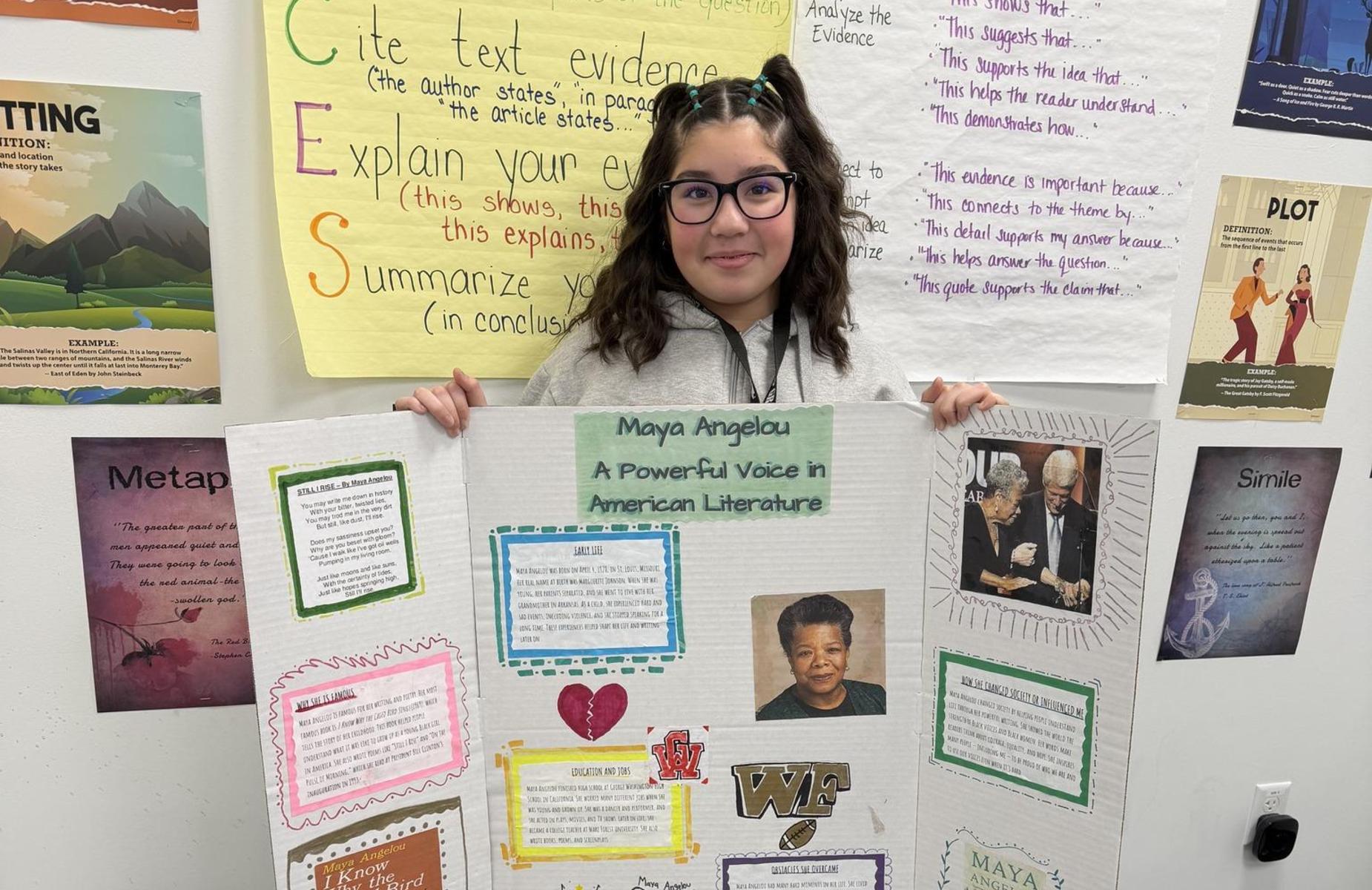 student holding black history month poster