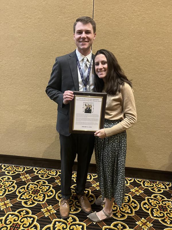 Benjamin Corneliusen receiving award