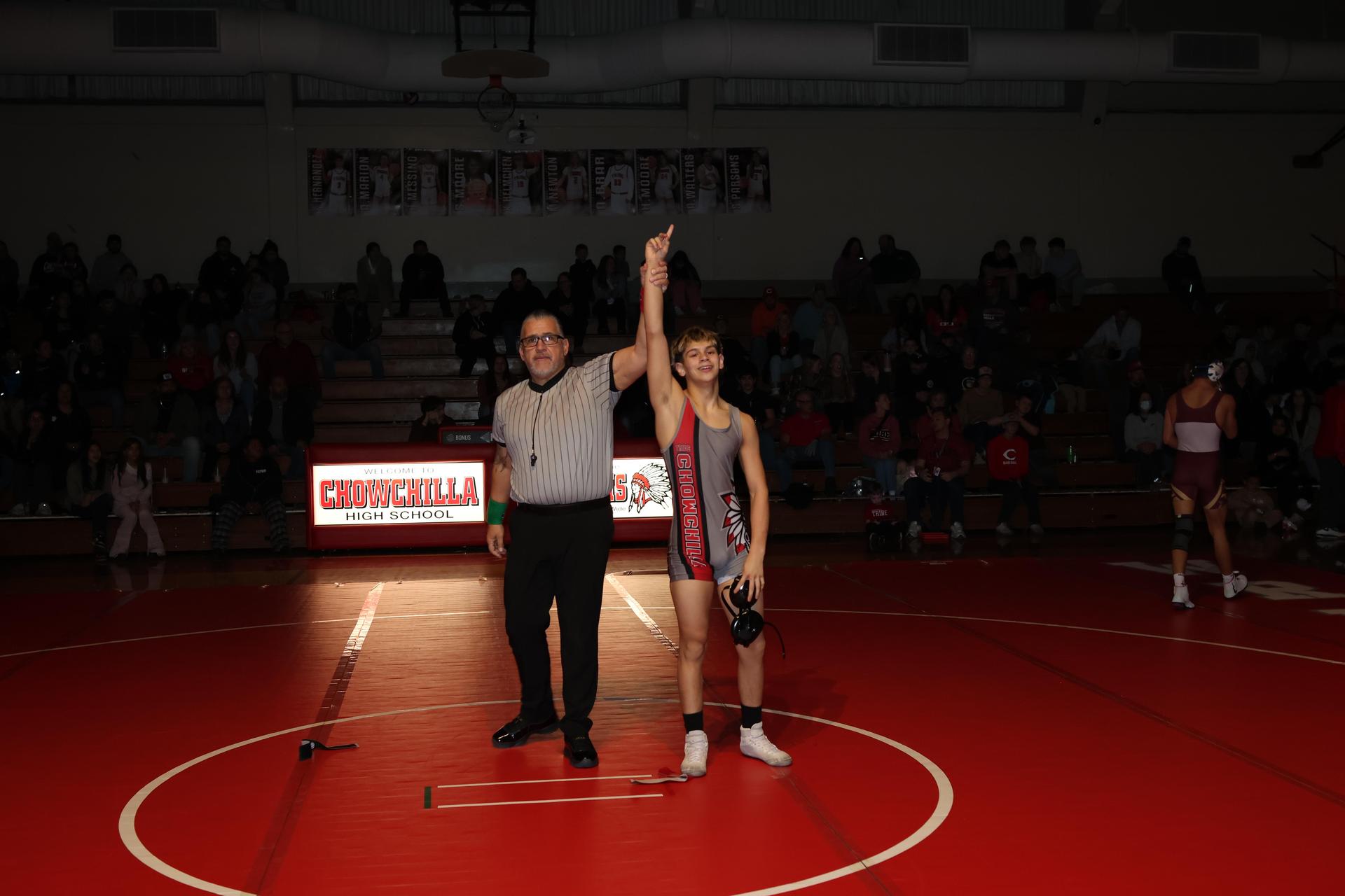 Wrestling winners with hands up 24