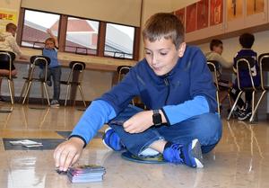 a student playing cards