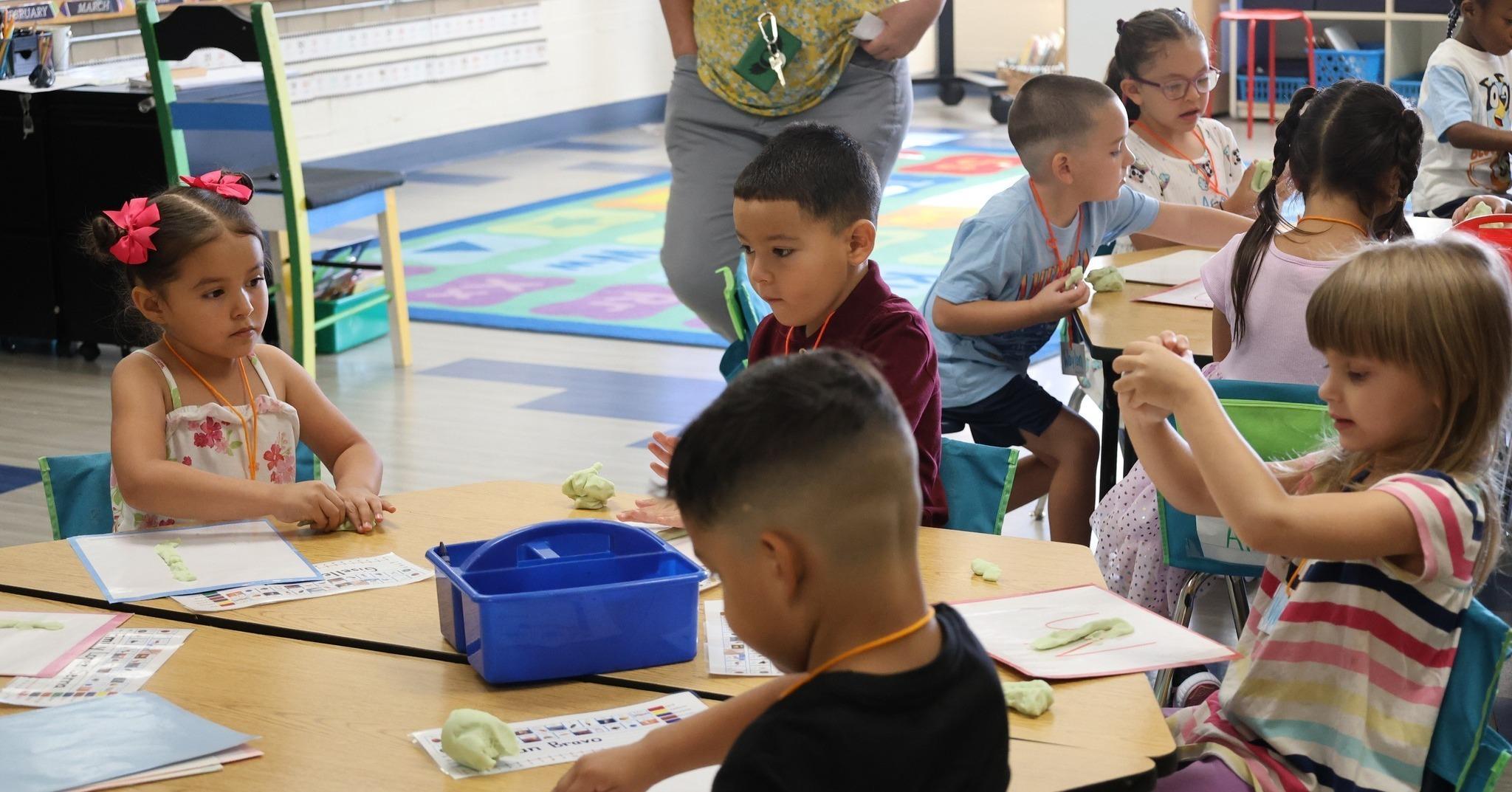 Kindergarten students at classroom table