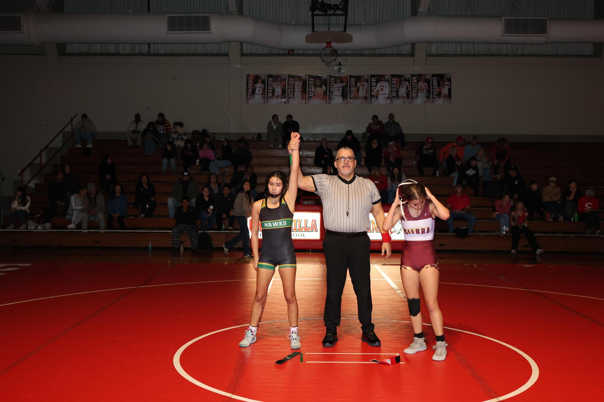 Wrestling winners with hands up 46