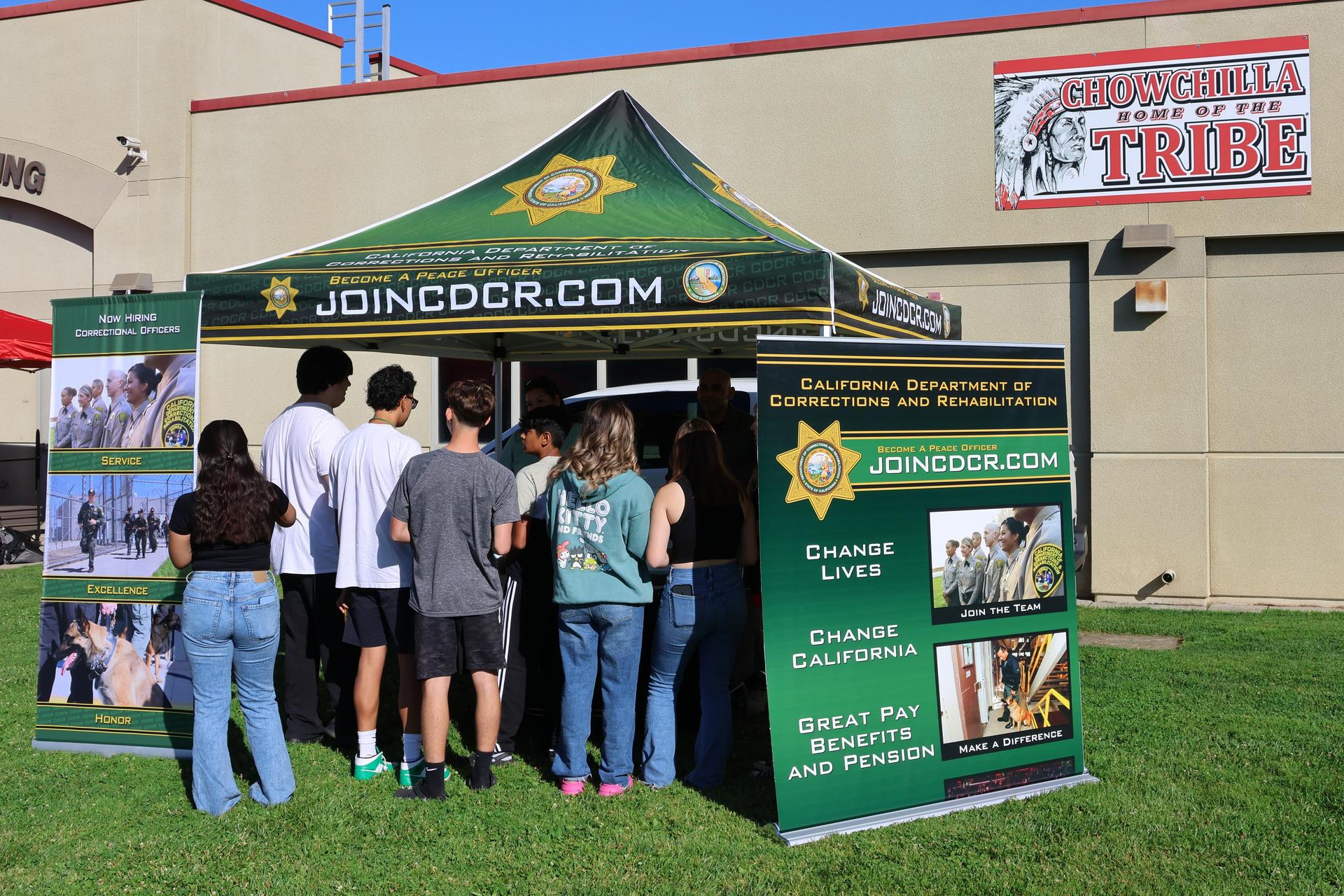 Correctional officers speaking to students