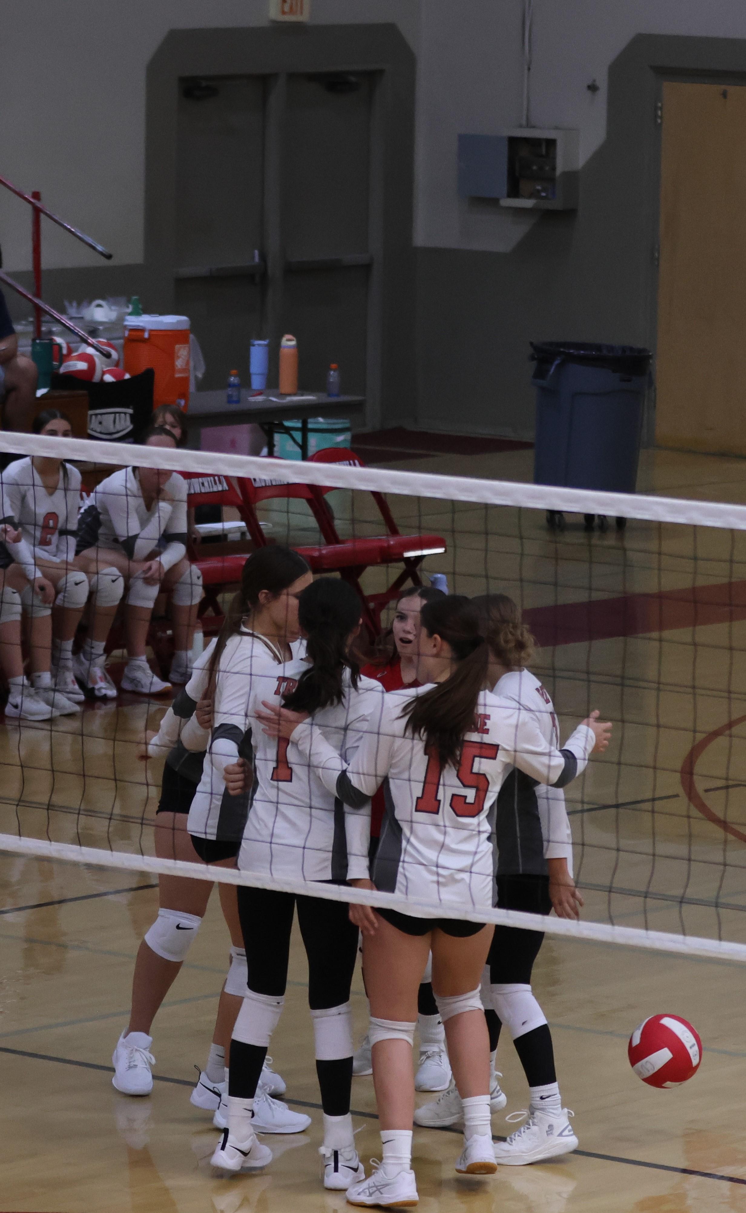 junior varsity girls playing volleyball 108