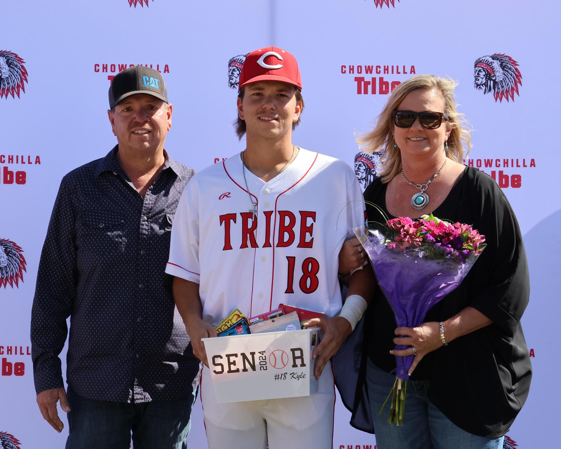 Seniors Posing With Teammates, Coaches, And Family