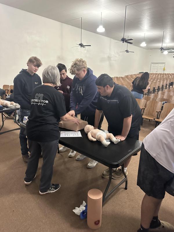 Senior students learning CPR.