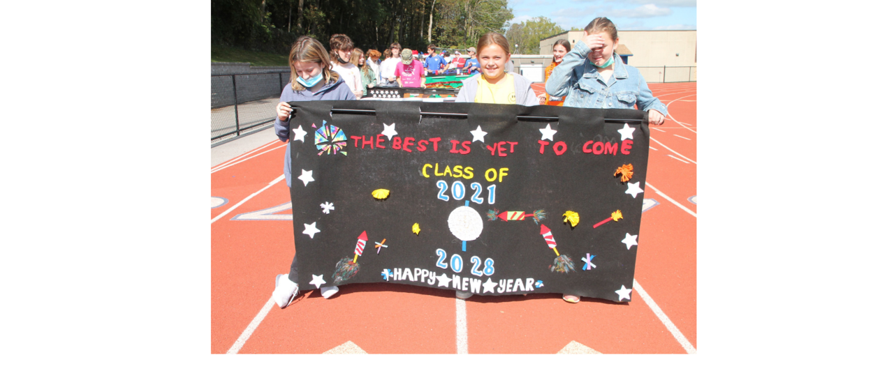 students walking with banner