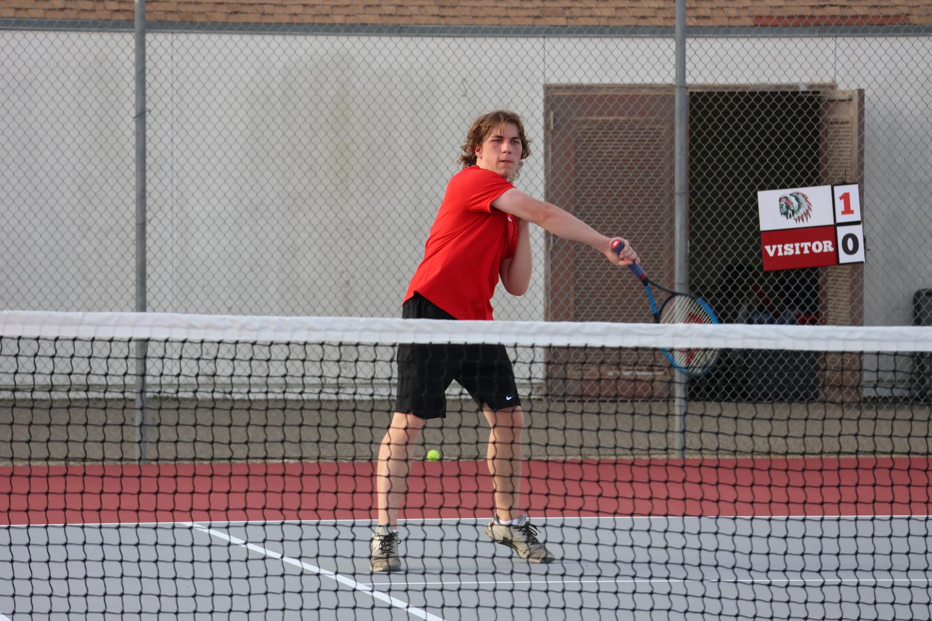 CUHS Boys playing tennis against coalinga