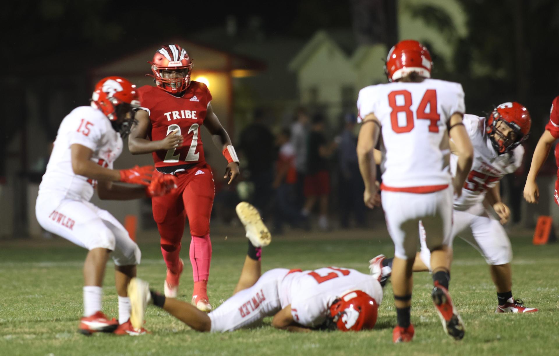 varsity boys playing football against Fowler