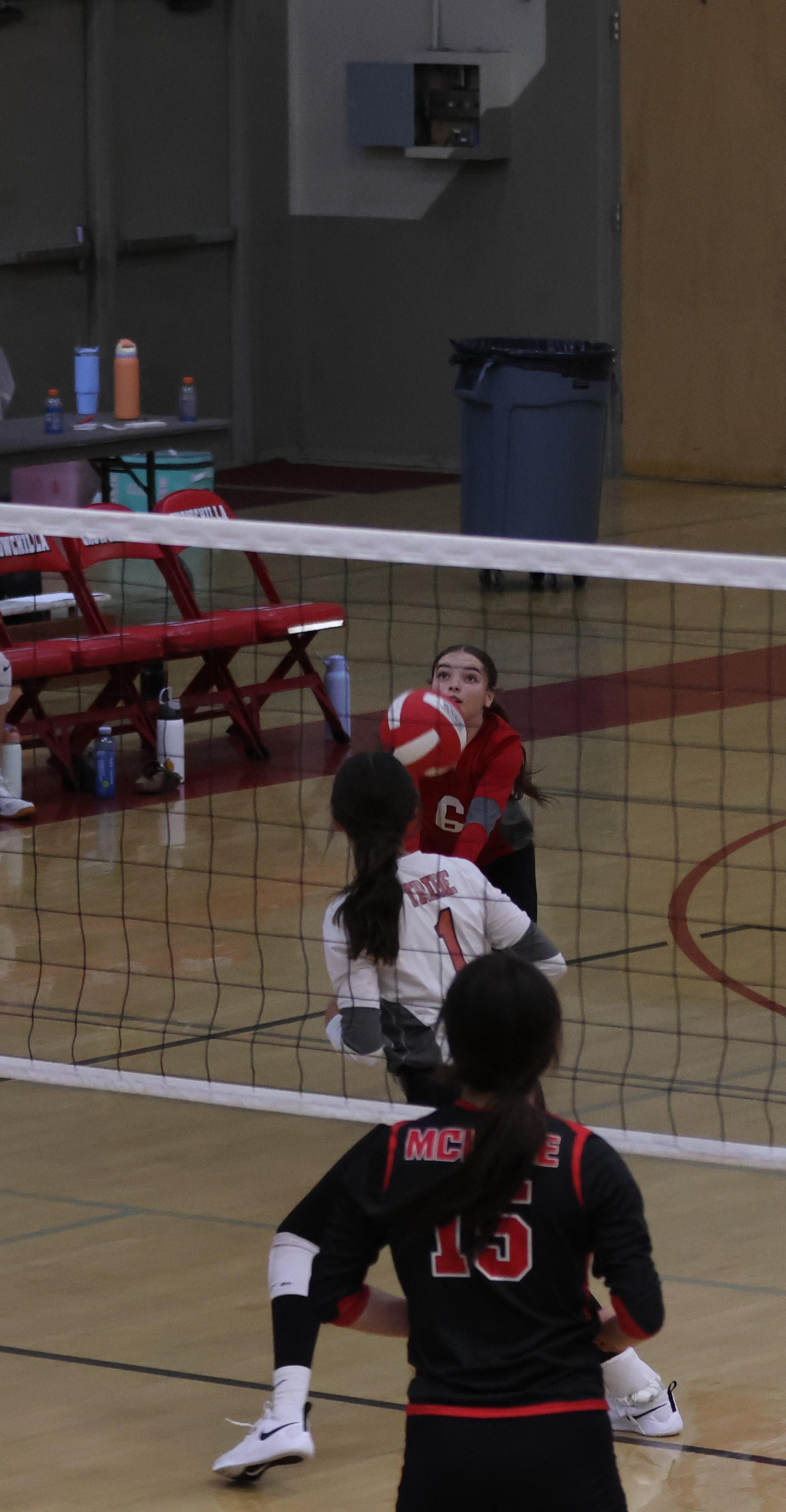 junior varsity girls playing volleyball 115