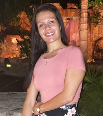 Informal head shot, smiling woman in a casual setting