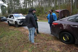 A Pike County Sheriff’s Office deputy stopped to assist Pike County citizens who were changing a flat tire