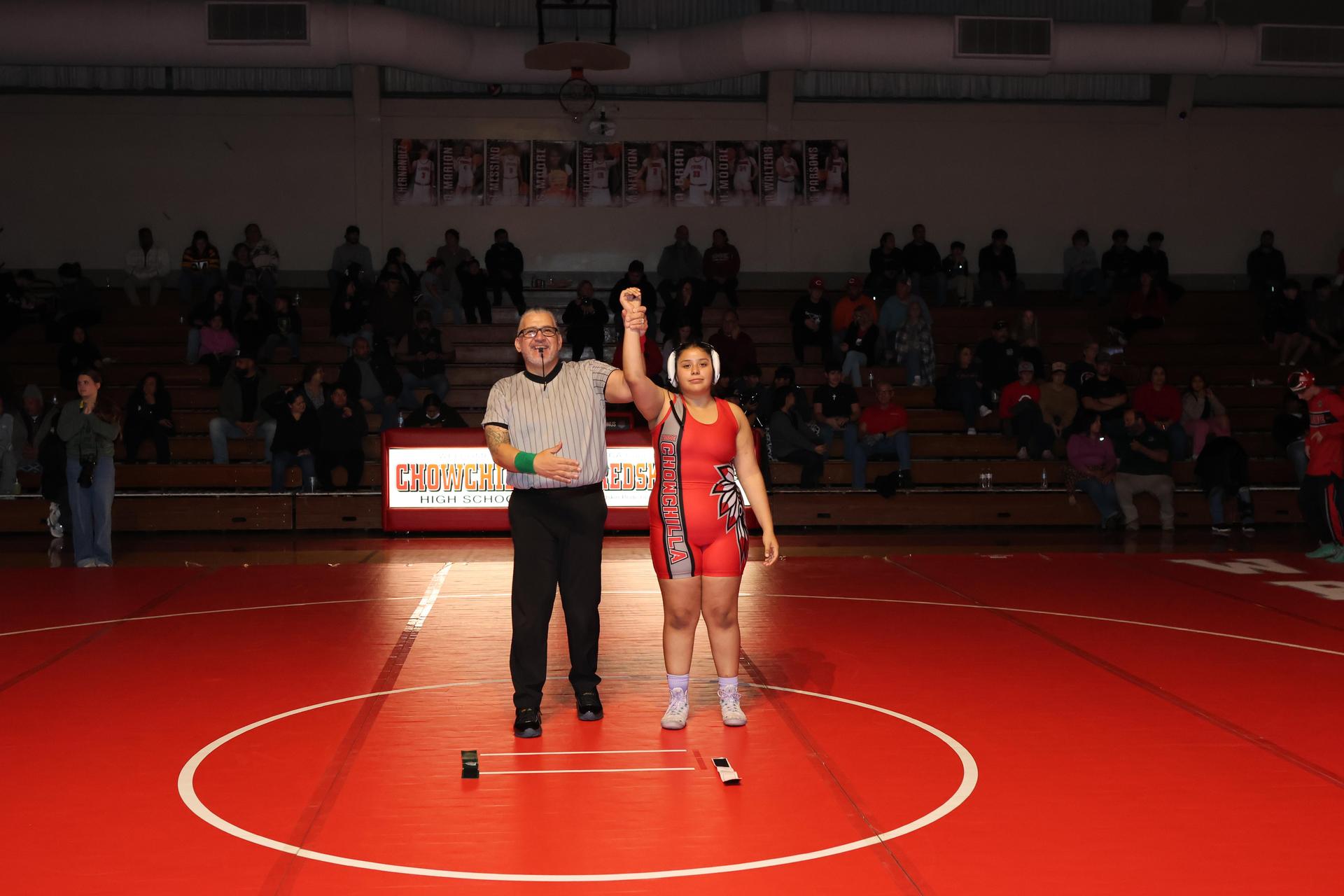 Wrestling winners with hands up 109